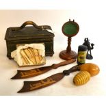 A treen pocket watch stand, two Sorrento ware paper knives,