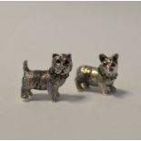 A miniature silver terrier, set rubies and emeralds, 2.