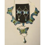 A silver and enamel butterfly necklace,