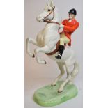 A Beswick Huntsman, rearing, style 2, painted white, 868, one of horse's ears restored,