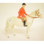 A Beswick Huntsman, painted white, 1501, three legs restored and ears damaged,