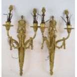 A pair of Louis XVI style brass two light wall lamps