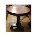 A Victorian mahogany centre table, on a tapering column,