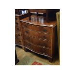 A reproduction walnut serpentine front chest of four long drawers, 79 cm wide, a similar chest,