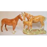 A Beswick Huntsman's Horse, palomino, 1484, and a Beswick Mare and Foal on Base, 2nd version,