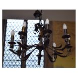An eight light metal chandelier, 65 cm wide,