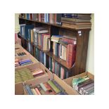 A rosewood open bookcase, having adjustable shelves,