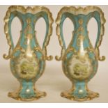 A pair of porcelain two handle vases, decorated landscapes,