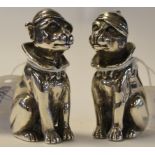 A pair of novelty silver salt and pepper pots, in the form of seated dogs, 5.