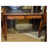 A Victorian mahogany writing table, on turned legs,