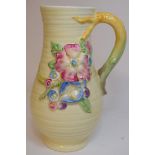 A Clarice Cliff Newport Pottery jug, applied flowers, 716, 20.