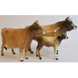 A Beswick Jersey Bull, 1422, a Jersey Cow, 1345, leg glued and tip of one horn chipped,