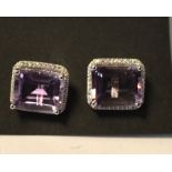 A pair of silver and amethyst stud earrings