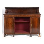 A Victorian rosewood bookcase, having a shelf above a recess, flanked by two cupboards,