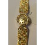 A lady's 9ct gold Rolex Precision wristwatch, the textured dial with baton indices,