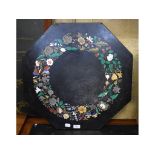 An Italian pietra dura octagonal top, inlaid with flowers and foliage, on a metal stand, some loss,