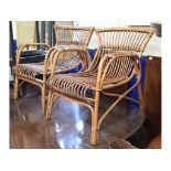 A pair of 20th century rattan armchairs (2)