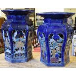 Two Chinese pottery blue glazed garden seats, with pierced decoration,