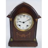 An inlaid mahogany mantel clock,