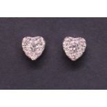 A pair of 9ct white gold and diamond hea