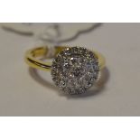 An 18ct gold and diamond cluster ring, a