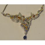 A silver butterfly necklace, set sapphir