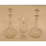 A pair of glass decanters and stoppers, with etched decoration, 32 cm high,