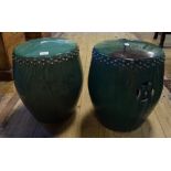 A pair of Chinese pottery green glazed barrel garden seats,