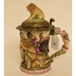 A Continental porcelain lidded tankard, decorated figures on horseback attacking lions,