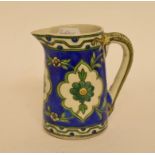 An Eastern stoneware jug, 13 cm high,