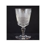 A Baccarat etched wine glass, decorated a house, 15.
