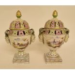 A pair of 18th century style Continental pottery pot pourri vases and covers,