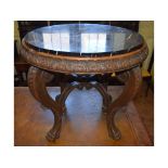A carved oak occasional table, with a ma