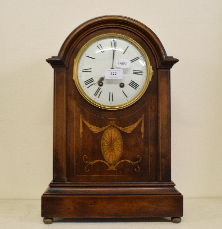 An Edwardian mantel clock, the white dia