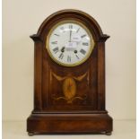 An Edwardian mantel clock, the white dia