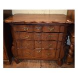 A Dutch oak chest, of shaped outline, ha