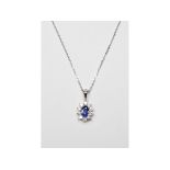 An 18ct white gold, sapphire and diamond