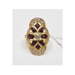 An 18ct gold, diamond and ruby panel rin