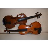 A violin, with a 13 inch two piece back,