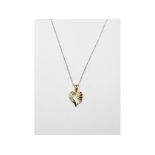 A 14ct gold heart shaped pendant, set di