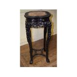 A Chinese carved hardwood jardiniere sta