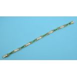 An 18ct gold, emerald and diamond bracel