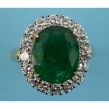 An 18ct gold, oval emerald and diamond c