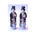 A pair of Japanese figures, of geisha gi