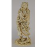 An amusing Japanese carved ivory figure,