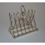 A novelty golfing toast rack, 15 cm wide