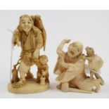 A Japanese carved ivory group, in the fo