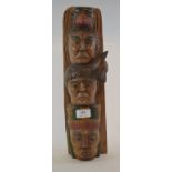 An Indian carved hardwood totem, 41 cm h