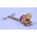 A Japanese carved ivory netsuke, in the