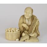 A Japanese carved ivory figure, in the f